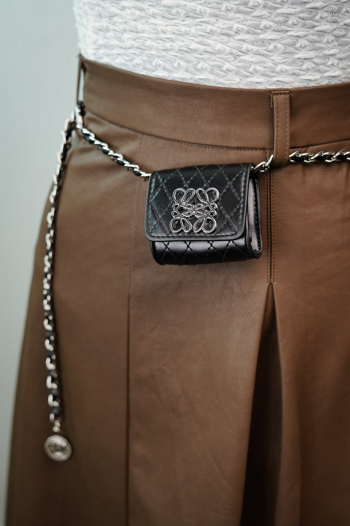 Compact Elegance Mini Bag Adorning a Stylish Chain Waist Belt