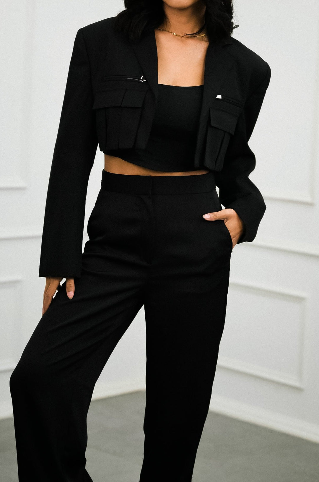 Stylish black cropped blazer with padded shoulders