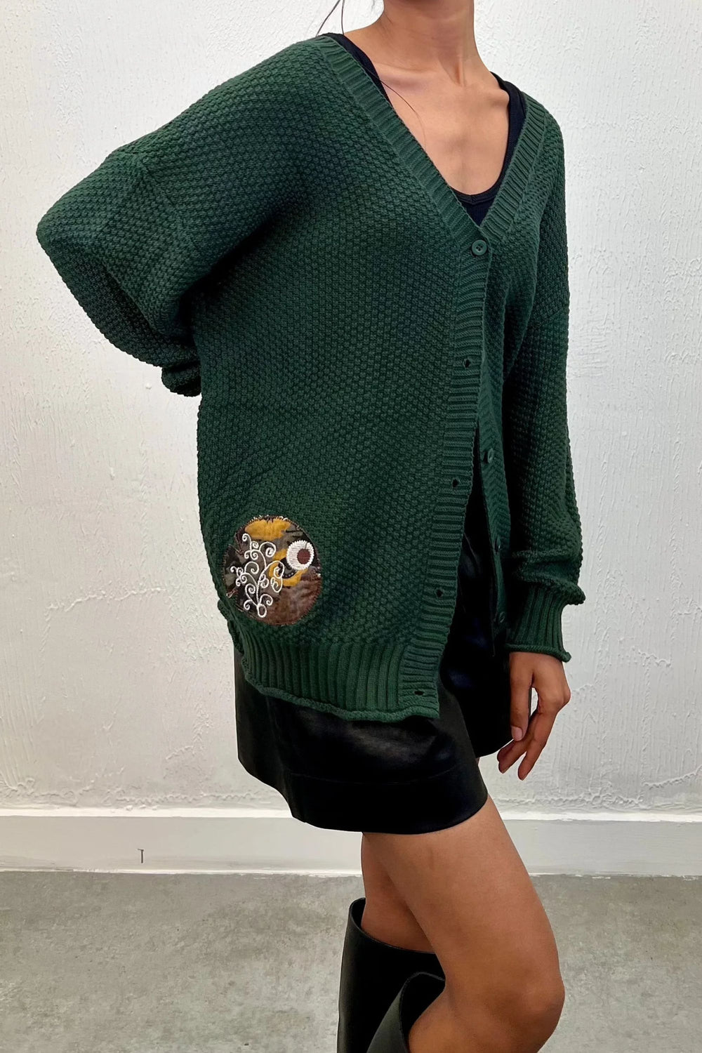 Comfortable dark green knit cardigan with buttons