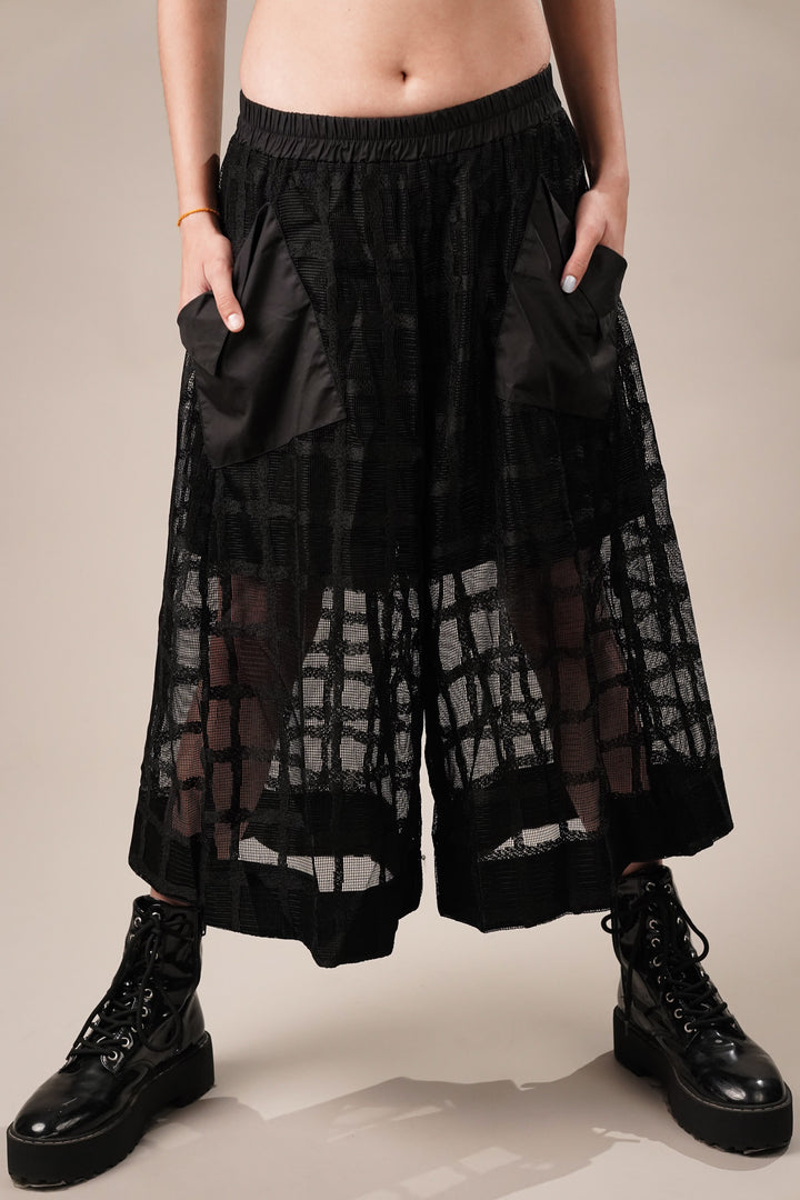 Trendy sheer black culottes with pockets