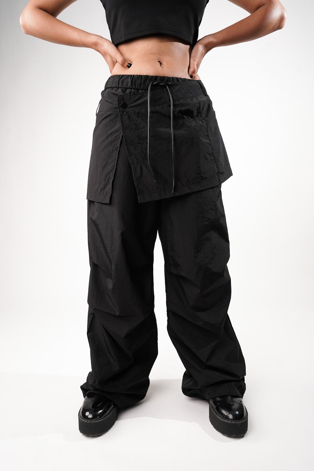 Layered black cargo pants with skirt