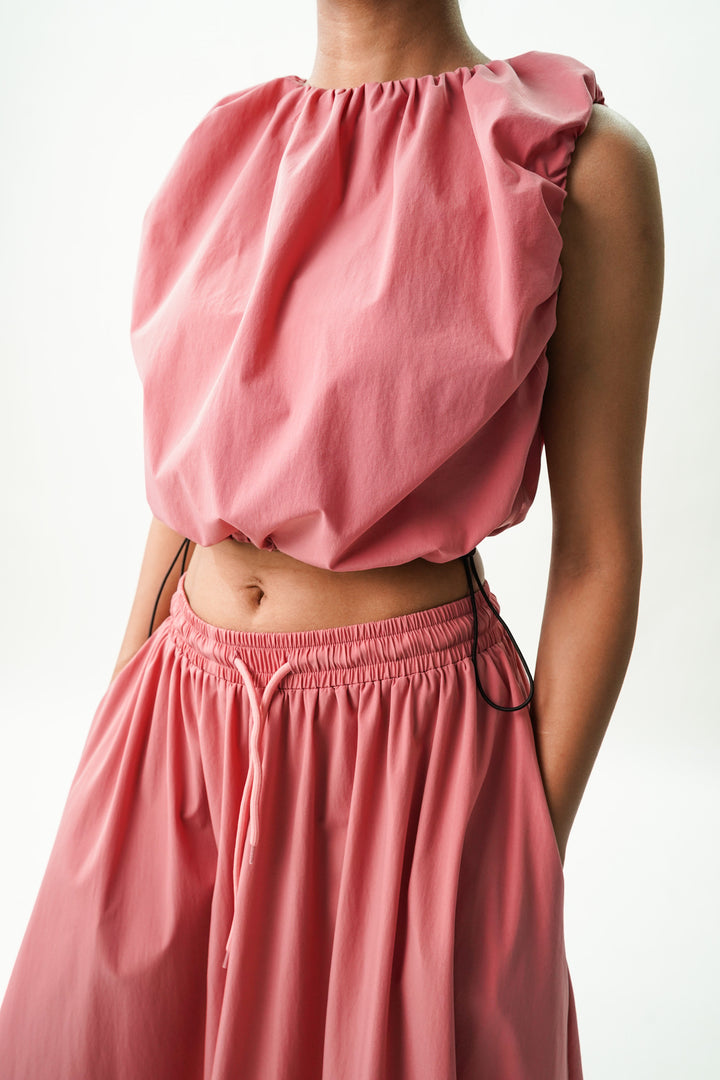 Trendy crop top and long skirt ensemble