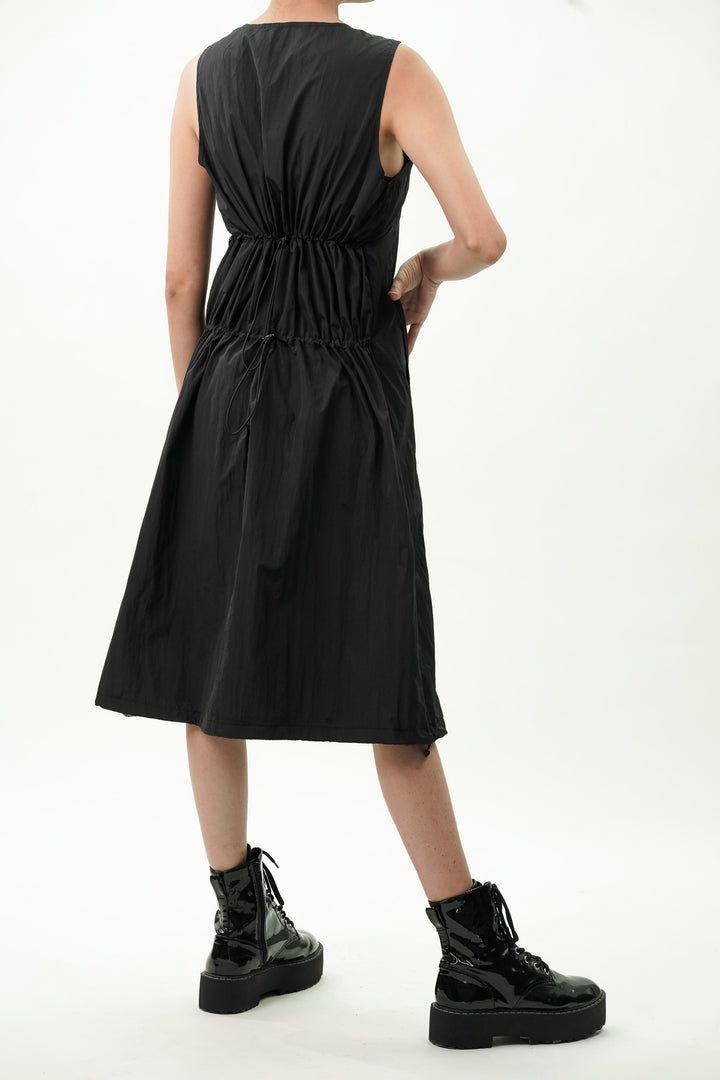 Women's black dress with hem drawstrings