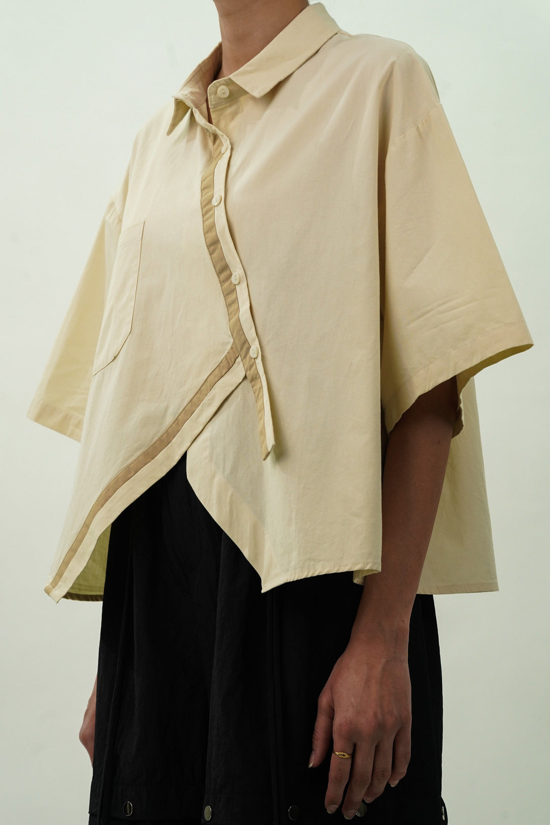 Trendy diagonal flap oversized shirt