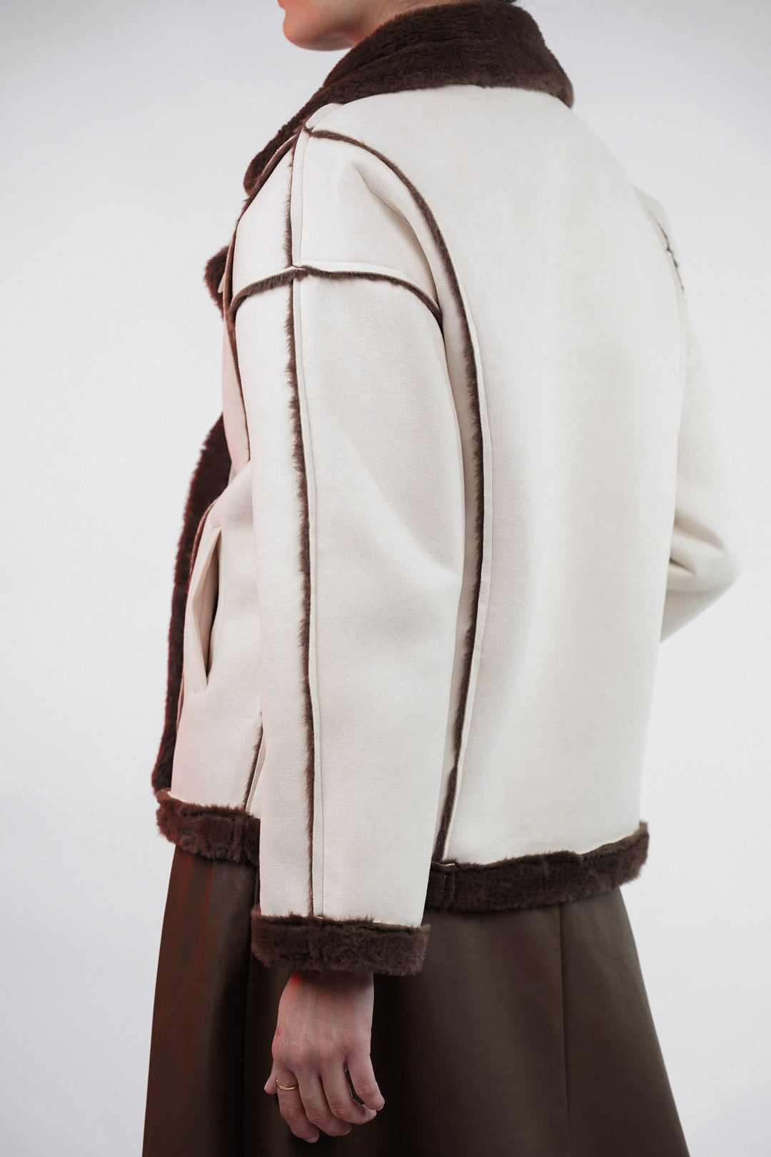 Elegant off-white jacket with fur detailing