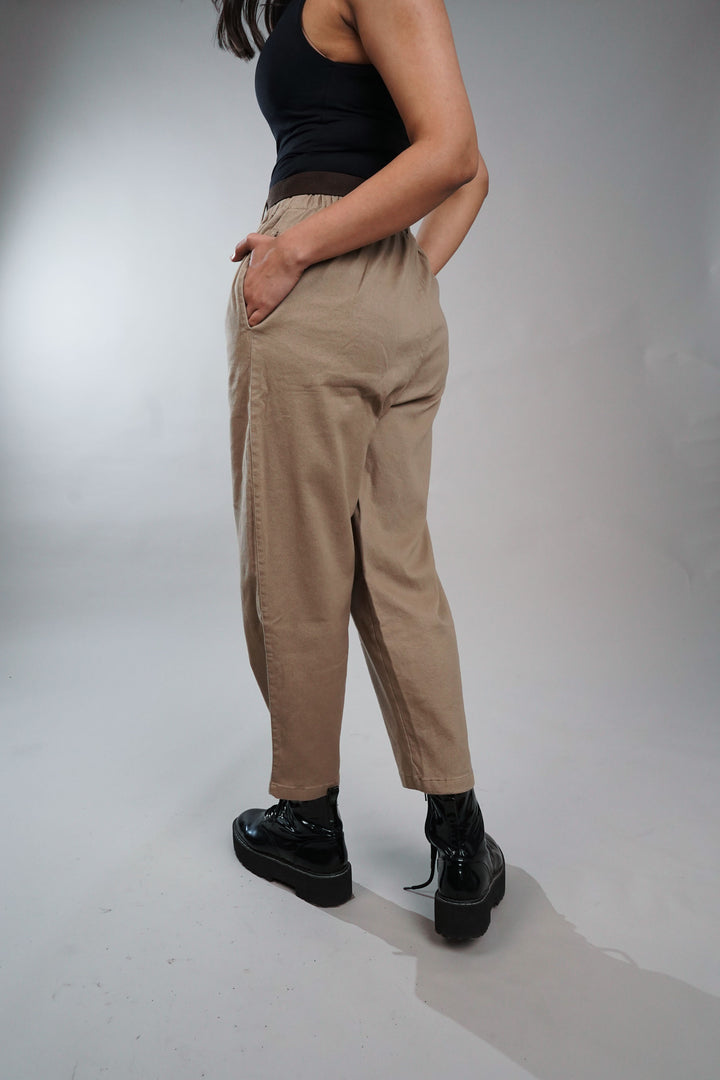 Women's relaxed fit cream trousers with belt