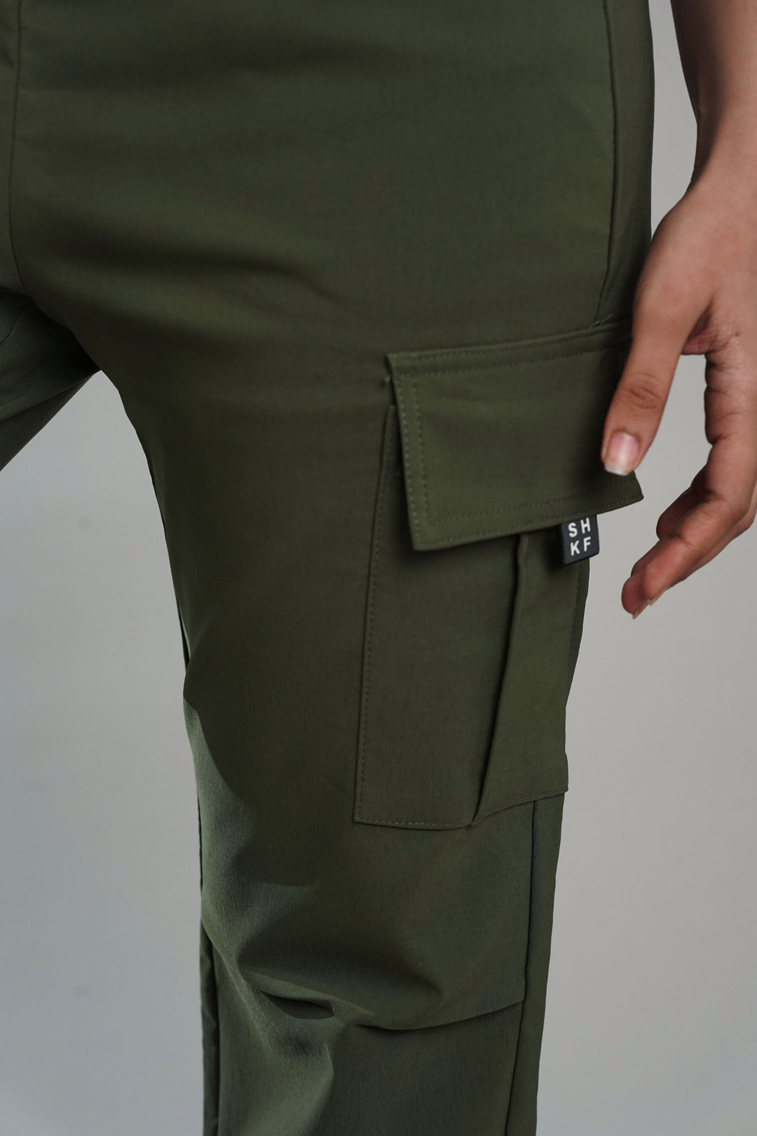 Stylish dark green cargo pants with flap pockets