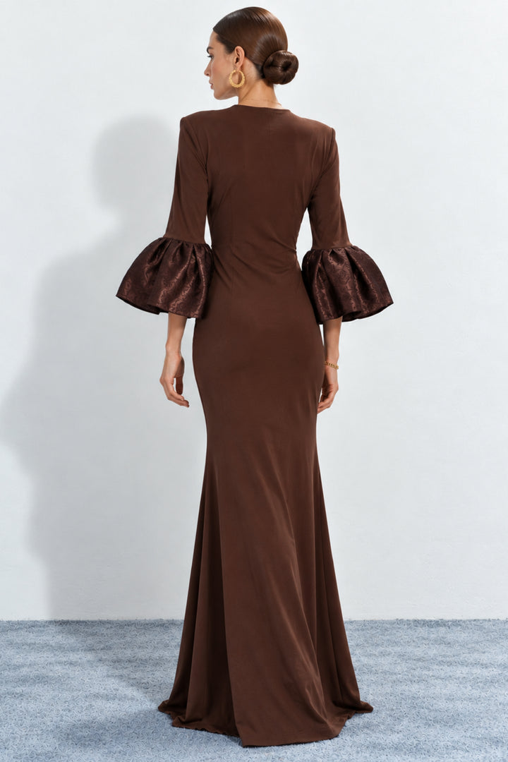 Brown mermaid-style gown with flared sleeves