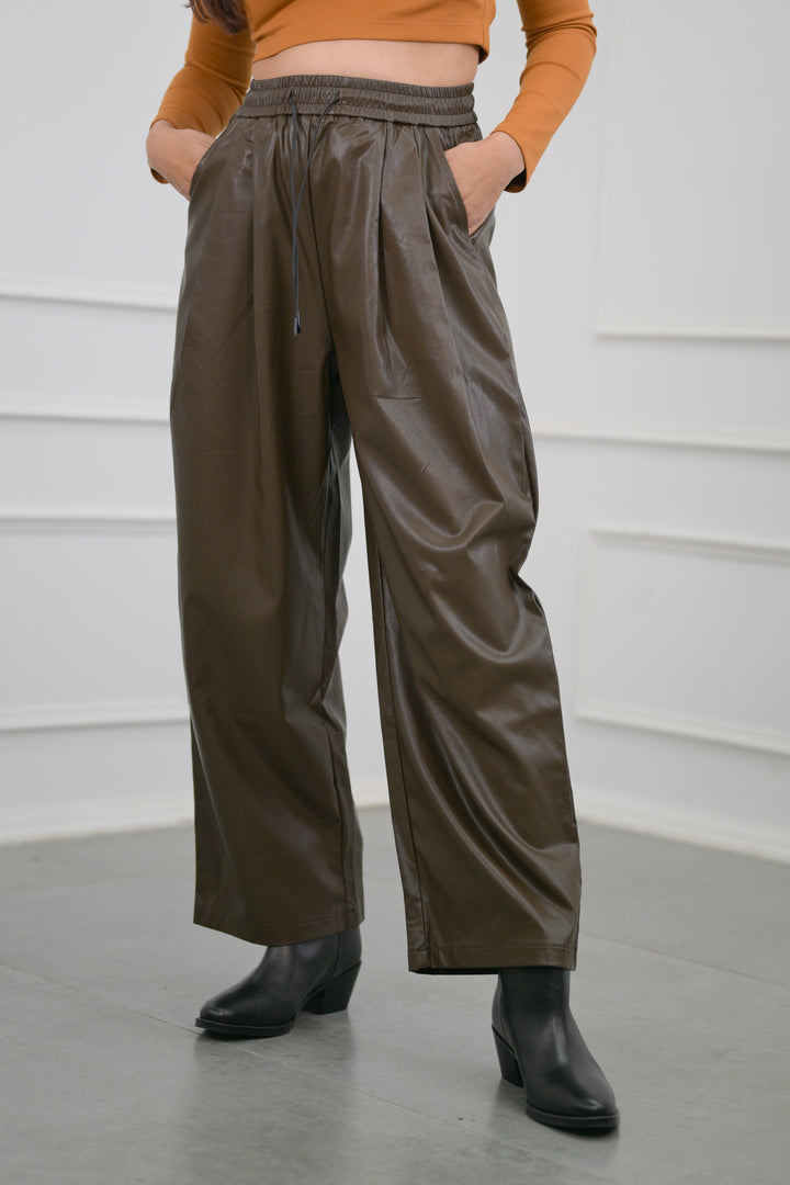 Stylish brown leather pants with elastic waist