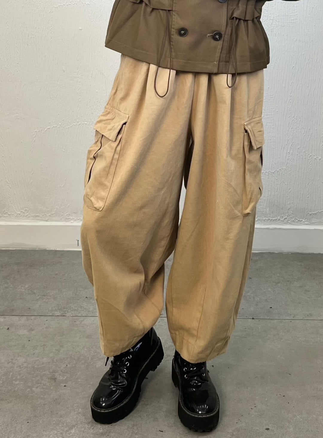 Oversized creamy yellow cargo pants with flap pockets